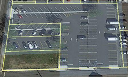 The Main Street area also contains several dozen irregular, unconnected or isolated paved areas used as parking lots. Almost all of these isolated lots are privately owned. (See image below.