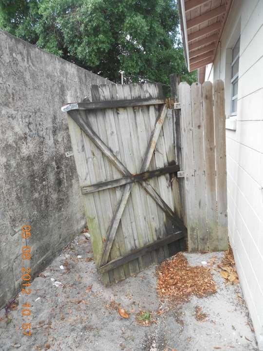 This damaged and unsecured fence provides access to the home s