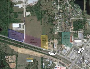 11 +/- acres in the heart of Magnolia. Includes 1750 sq ft house, perfect for office/business, central a/c & heat, fenced.