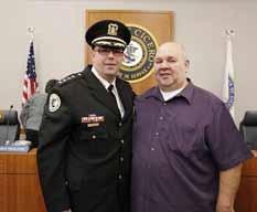Gang related homicides are down and it is because of your hard work, Dominick said at the board meeting after he swore Chlada in as Police Superintendent.