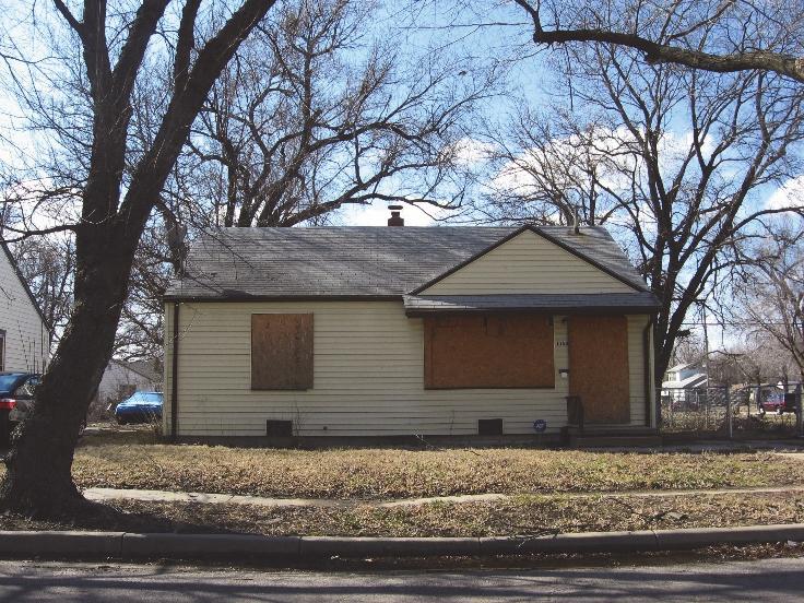 EXHIBIT A Over the last few years literally hundreds of vacant houses like the pictured house have been bulldozed for housing code violations by the City of Wichita and the property owner(s) were