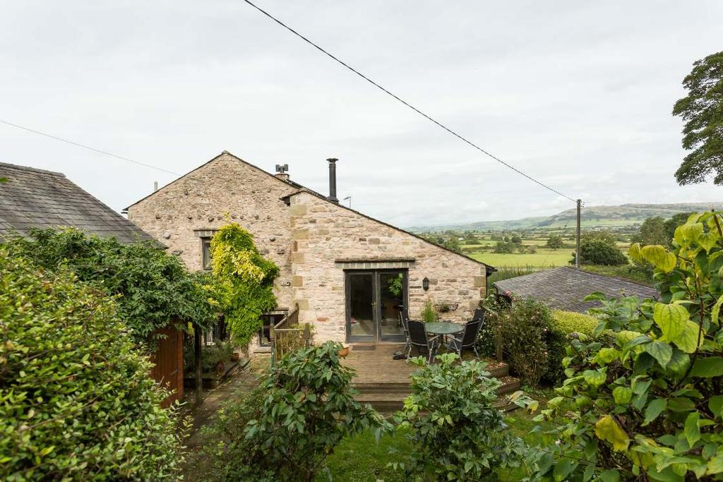 The main entrance at the front of the barn is reached by way of a cobbled courtyard area with stone staircase and leads to an inner hallway from where two spacious bedrooms sit with access to a well