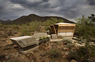 Nestled among the cactus thickets and dry washes of the Arizona desert lies an intriguing landscape of architectural experiments.