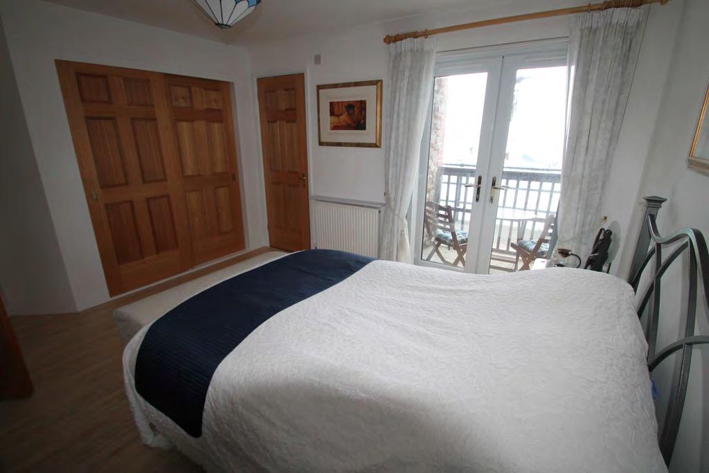 The master bedroom is a good size double bedroom and provides access to an ensuite shower room with shower, wash hand basin and WC, double doors lead to a private balcony, perched right on