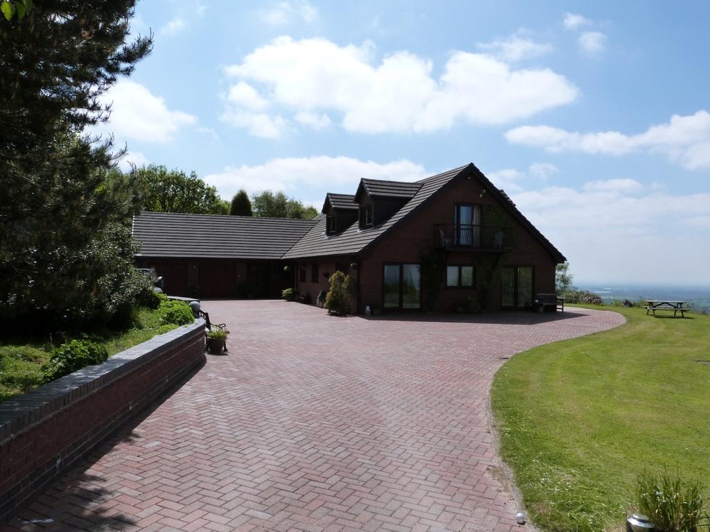Chartered Surveyors Valuers Estate Agents Auctioneers THE WOODLANDS QUARRY WOOD FARM WOOD STREET MOW COP CHESHIRE ST7 3PF Individually Designed Family Home Breathtaking Views Over The Cheshire Plain