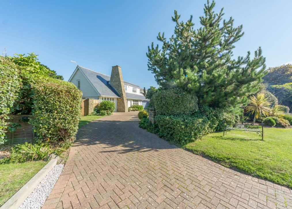 The property is approached from dual entrances with a sweeping block paved carriage driveway linking the two, and giving way to the integral garaging.