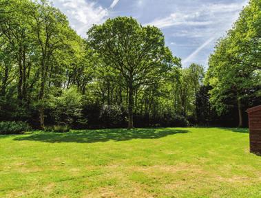 Accessed via a private no through road, Timbers is set behind electric wooden gates with a gravelled driveway leading to a large turning circle at the front of the house offering parking for multiple