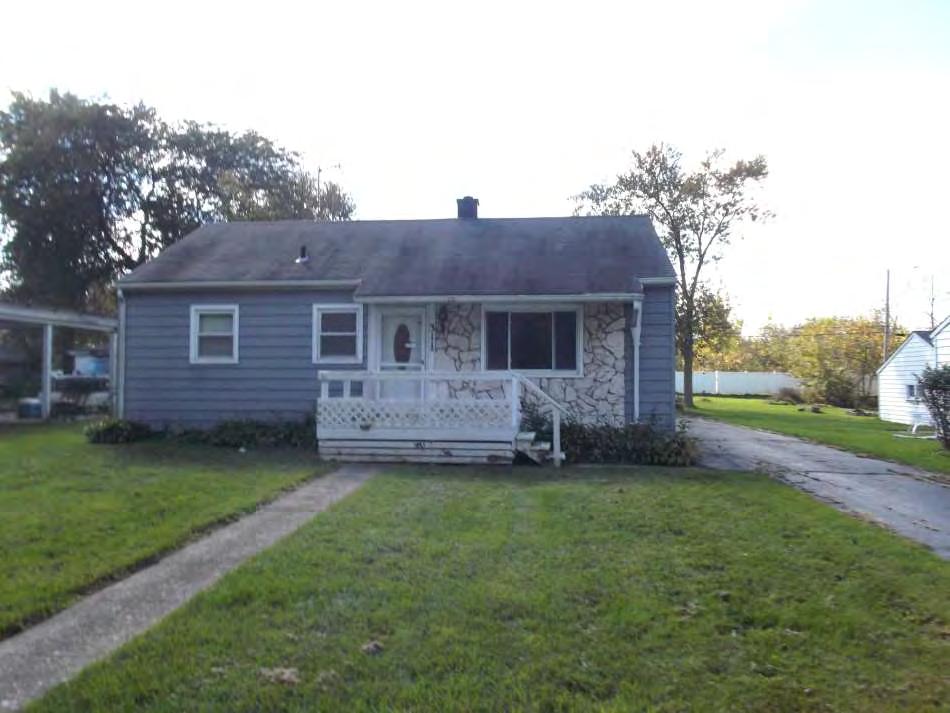 This Bank of America foreclosure in a White neighborhood in Crown Point has a recently mowed and edged lawn and has no