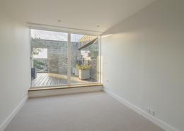 To the rear of the hall on the ground floor there is a large garage which can accommodate 2 cars with further storage if