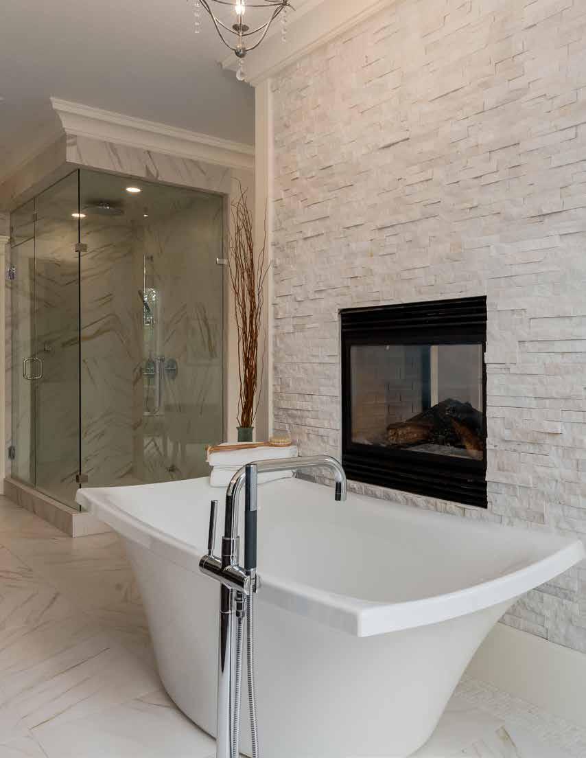 Eensuite Crown molding runs from the bedroom into the open ensuite bathroom, which boasts a massive double vanity