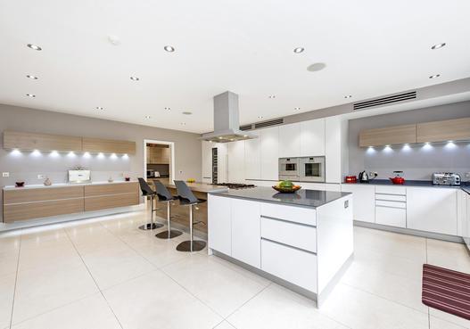 luxury Valcucine fitted kitchen/family room with granite work tops, and featuring Gaggenau and Miele appliances. The ground floor accommodation is completed by a cloakroom, utility room and boot room.