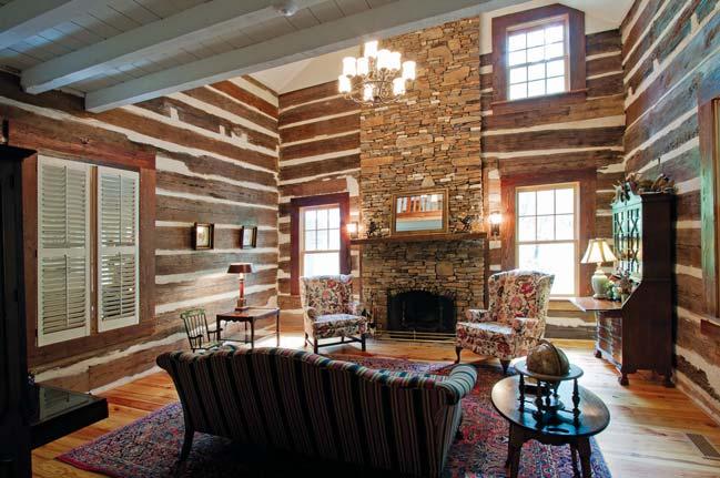 CLOCKWISE FROM ABOVE: Leaving the living room open overhead allows the fieldstone fireplace to soar