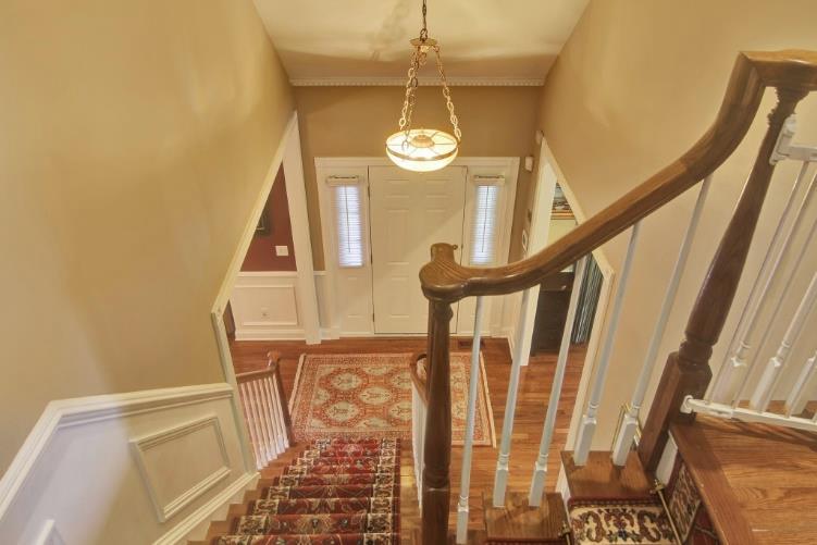Beautiful millwork, hardwood flooring, volume ceilings, and tasteful architectural elements create the perfect space to