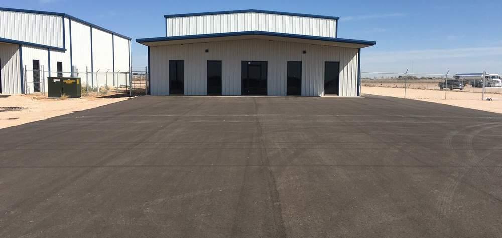 Employee Customer parking is asphalt while the lot is caliche with exception of back 100 feet of lot is dirt. 3 phase power - all electric buildings.