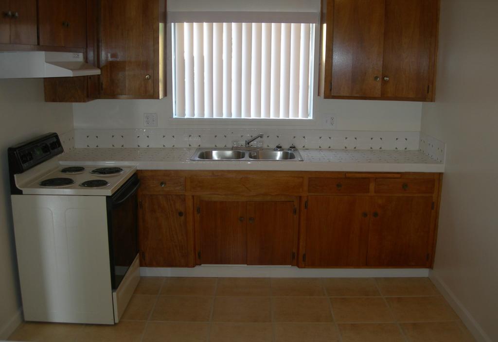 Typical Interior Upgrades. Tile flooring and countertops, stove, hood, fixtures.