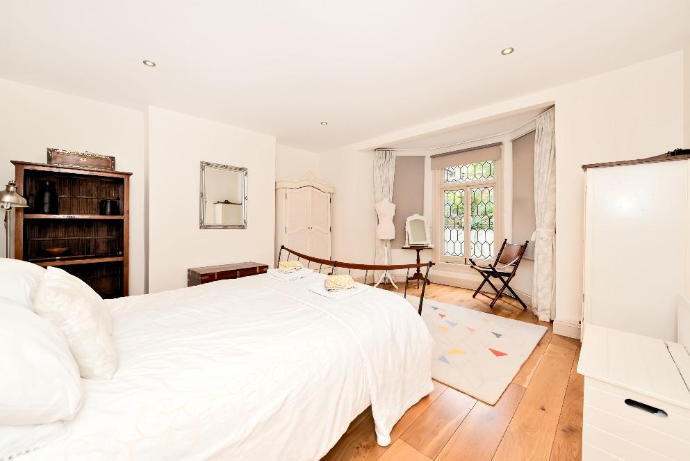 At the back, this room's also ready for your move with fitted wardrobes already in place.