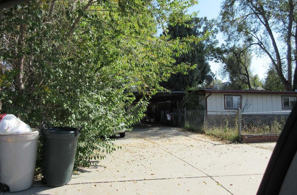 A view of the home and carport immediately to the north of the subject property, 4084 Independence Court.