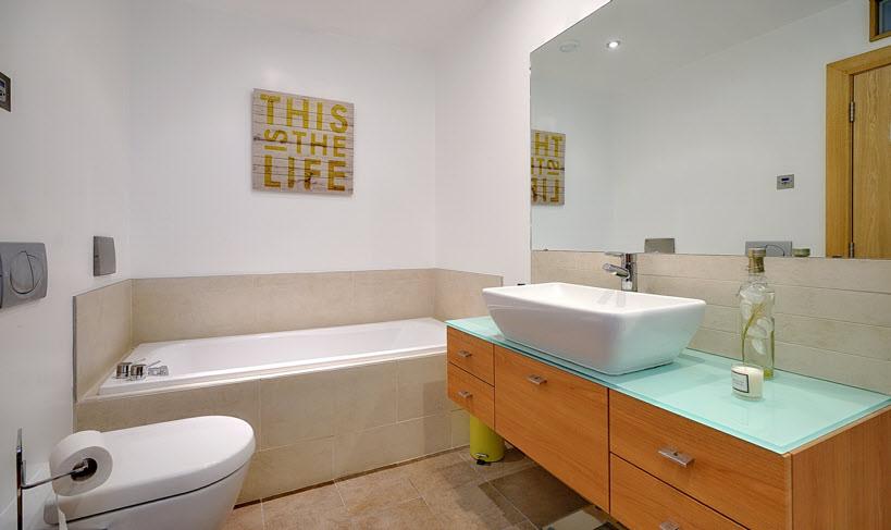 with over head shower unit and body shower, heated towel rail,