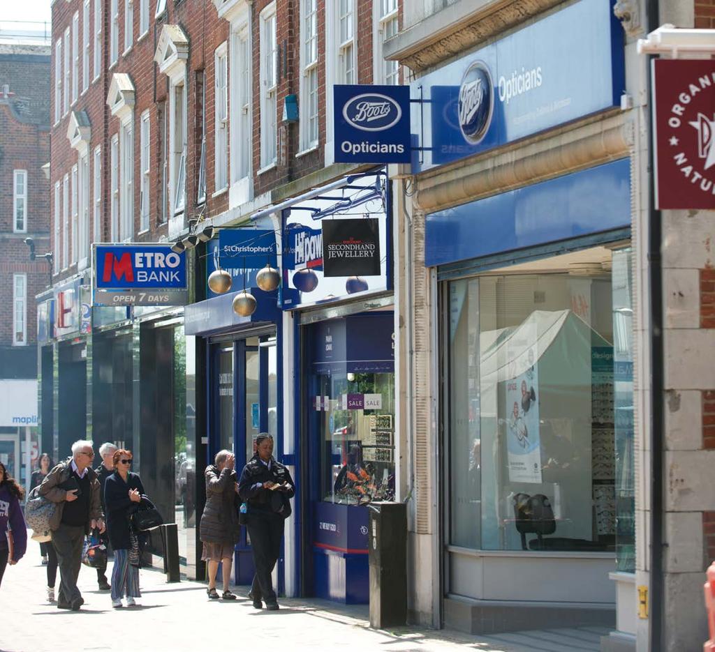 SITUATION The subject premises are situated in a prominent trading location on the pedestrianised High Street, directly opposite the main entrance to The Glades Shopping Centre and in close proximity
