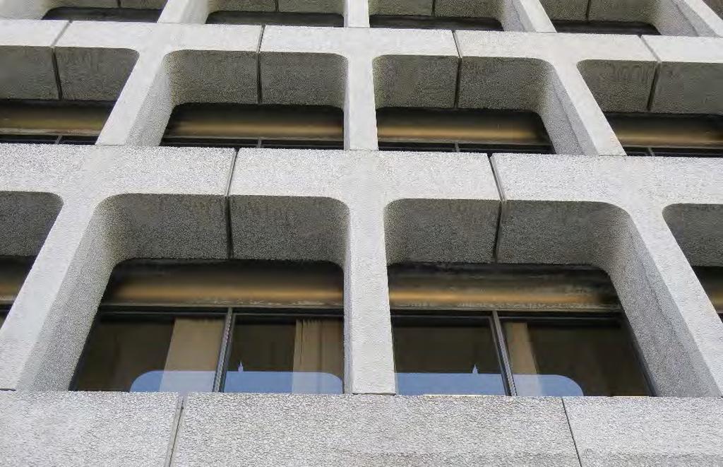 Close-up of upper floors and granite aggregate cladding at the north