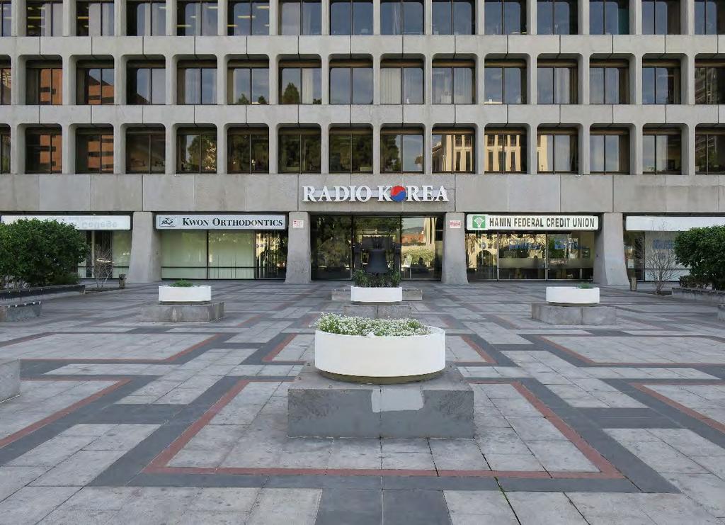 Concrete and granite hardscaped plaza with circular