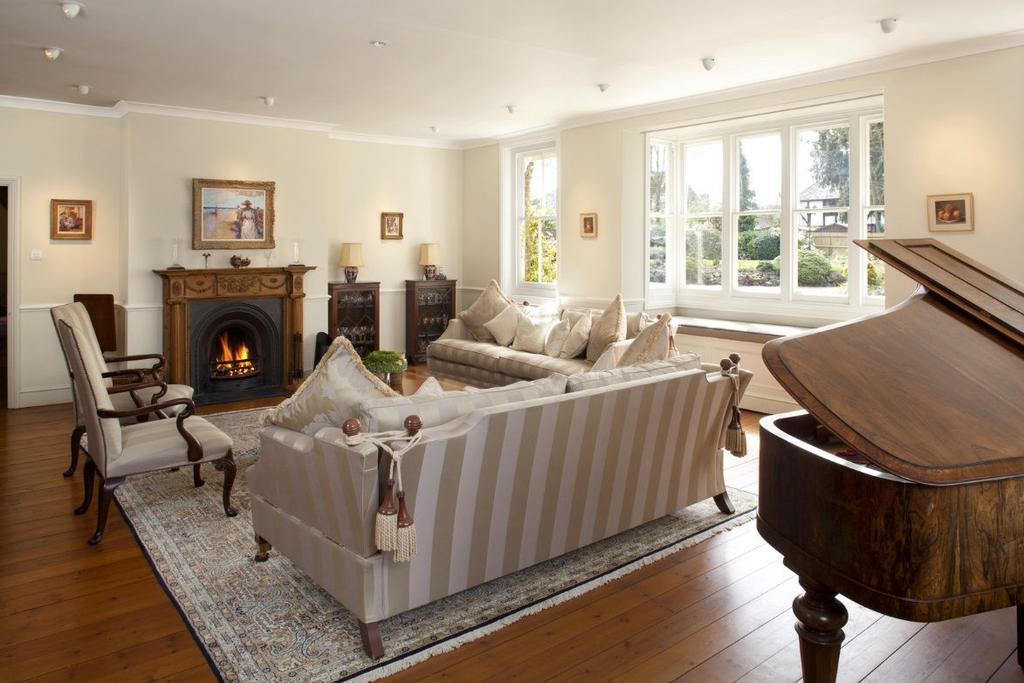 Five lovely reception rooms with stylish drawing room. Sophisticated, double aspect master bedroom with superb en suite. Seven further bedrooms and four bathrooms.