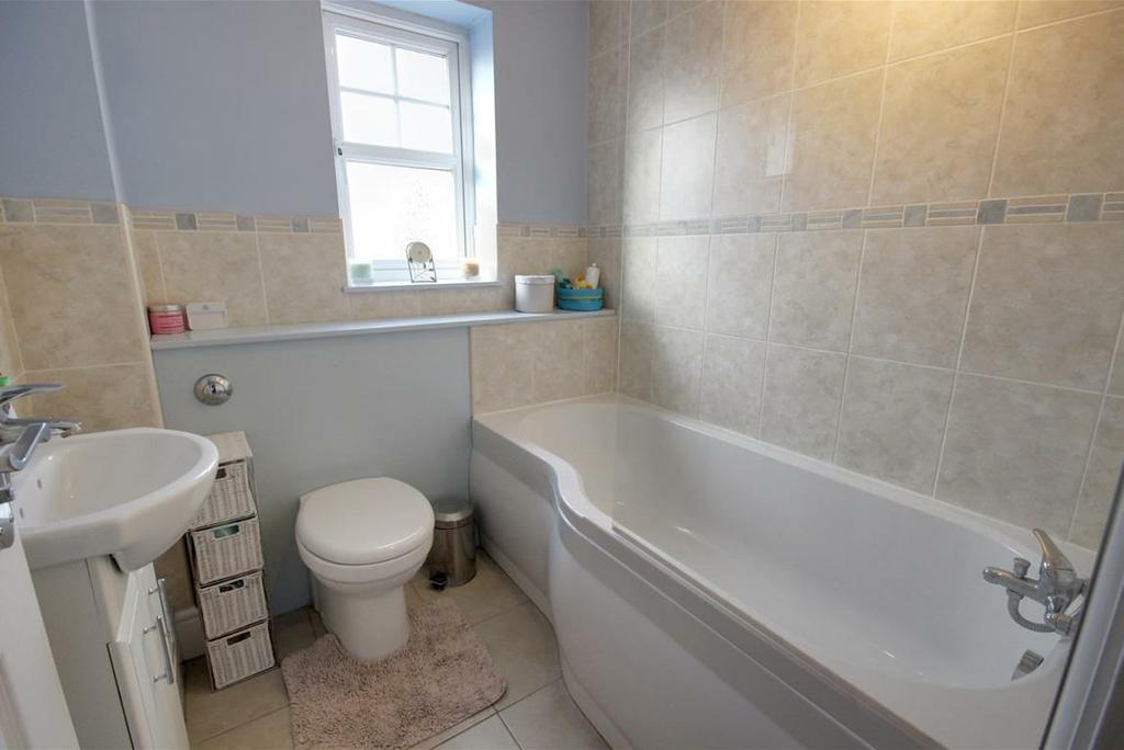 BATHROOM With suite comprising bath with shower over and screen, vanity
