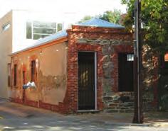 215 Wright Street Status: Local Heritage Place History: This dwelling stands as an example of Adelaide s early vernacular architecture being constructed in blue stone and hand made red brick.