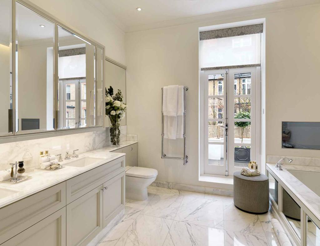 MASTER BATHROOM This beautiful master bathroom has a double vanity unit, a marble