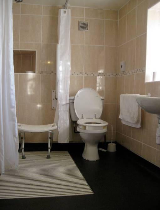 Ground floor shower room and WC Directly off hallway with level access from the hallway Bi-fold door with 800mm clear opening width Total area of room is 2440mm x 1700mm WC,