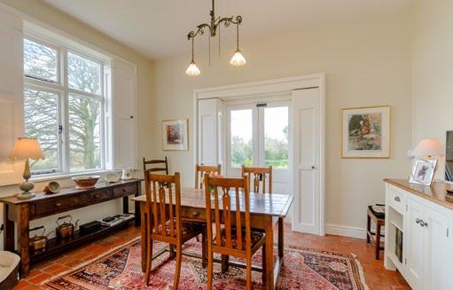 ACCOMMODATION Attractive arched surround to an open entrance vestibule. Fine hall with a Minton tiled floor to a galleried landing over. Morning room/study.