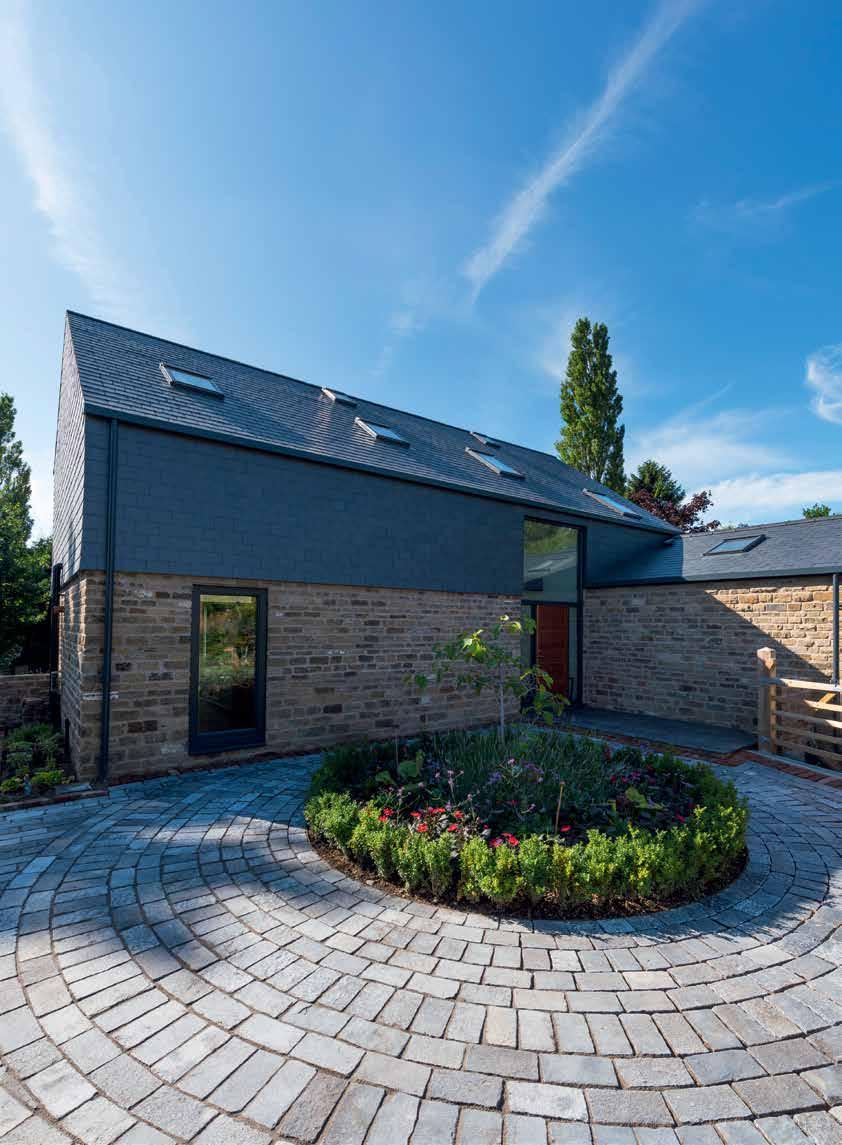 Architect s View Martin Bell, Transform Architects: Our brief was to design a family home that would be both contemporary and environmentally friendly, within the garden of an existing detached