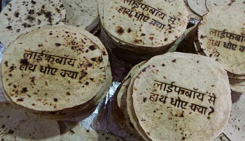 EDIBLE BRANDING 2014 VIPUL SLVI SYSTEMS Rotis, (Indian flat bread) with printed advertisement for soap on it, Have you washed your hands with Lifebouy today?