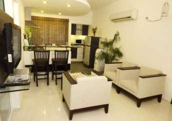 Fully-furnished Living Area and well-stocked modular Kitchenette for each apartment Writing desks and Luggage racks in each room LCD TV with set-top box with all cable channels in all the rooms and