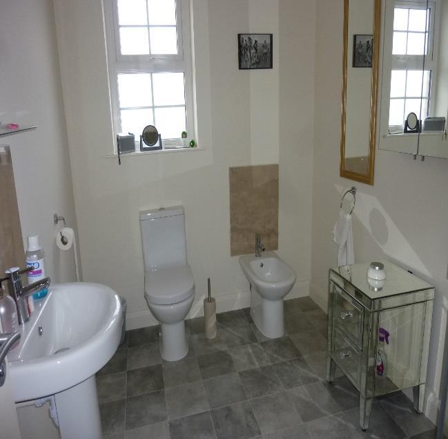 includes Walkin corner shower cubicle with pressurized shower from mains water system,