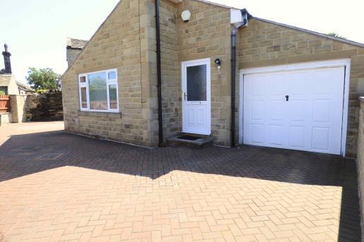 space for five cars (including the garage), or three cars with ample space for a caravan to the side of the property.