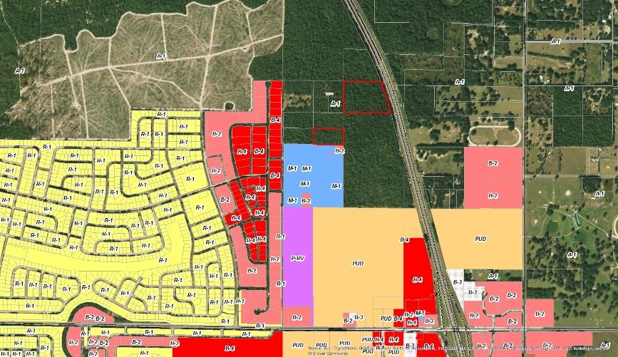 All surrounding properties are vacant, native upland forest. The proposed use is all uses allowed in Employment Center and there is no concurrent zoning application.