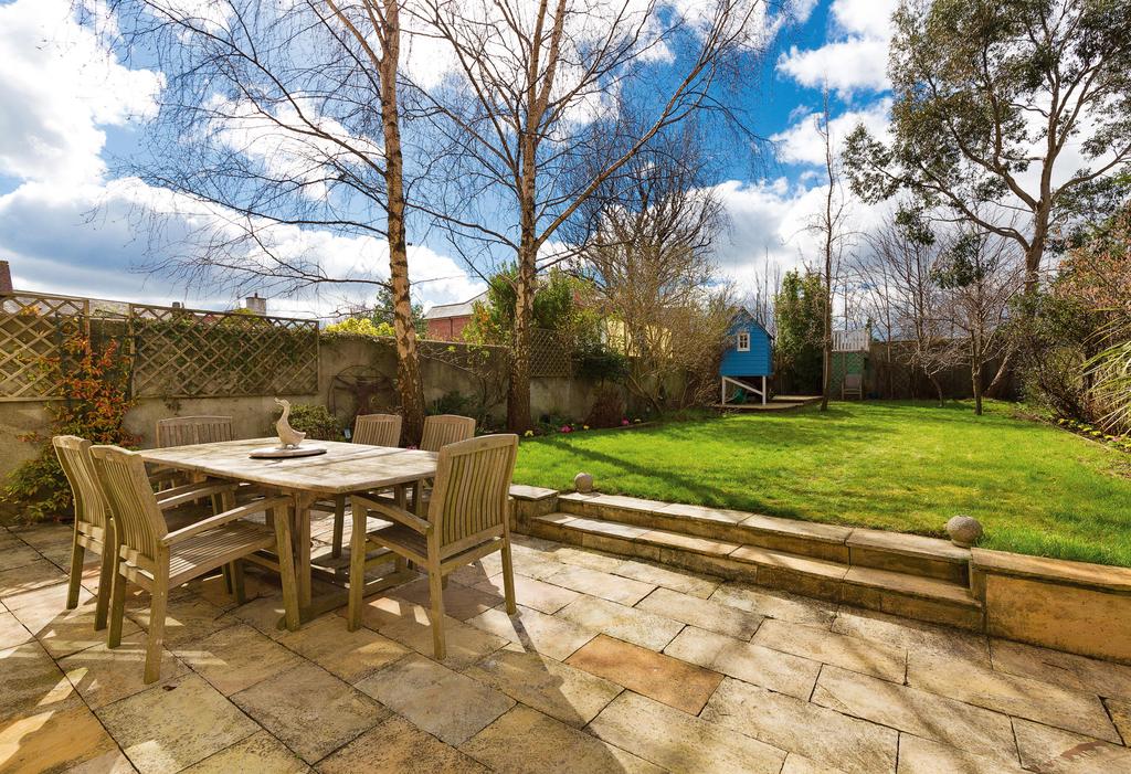 Outside To the front, there is a railed garden with cobblelock driveway providing ample off-street car parking bordered by landscaped flowerbeds, original terracotta/grey tiled porched entrance and