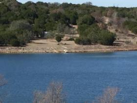 Scenic waterfront lot on pavement near the front of this quiet development of Mountain Lakes. Elevation changes give a Make this your showplace! 1.