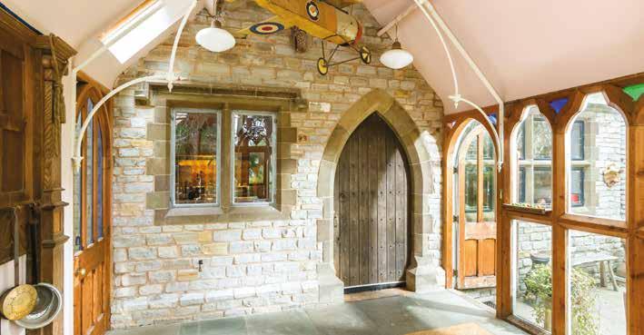 There is access from the conservatory to the garden and a heavy oak gothic door giving access to the kitchen, which provides a wealth of character.