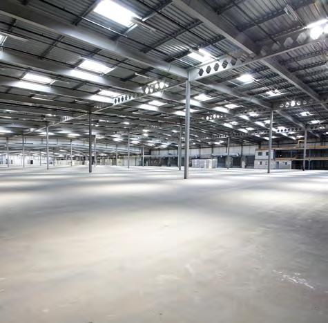 3m eaves in southern section warehouse 14 dock level electric loading doors 2 surface level doors Heating and lighting Concrete floor Forklift charging areas Works welfare facilities/ stores/ canteen