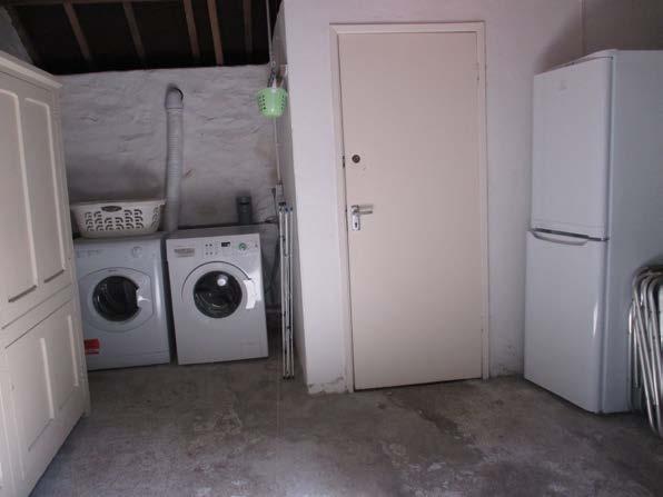 Laundry Room There is a washing machine and tumble dryer and an