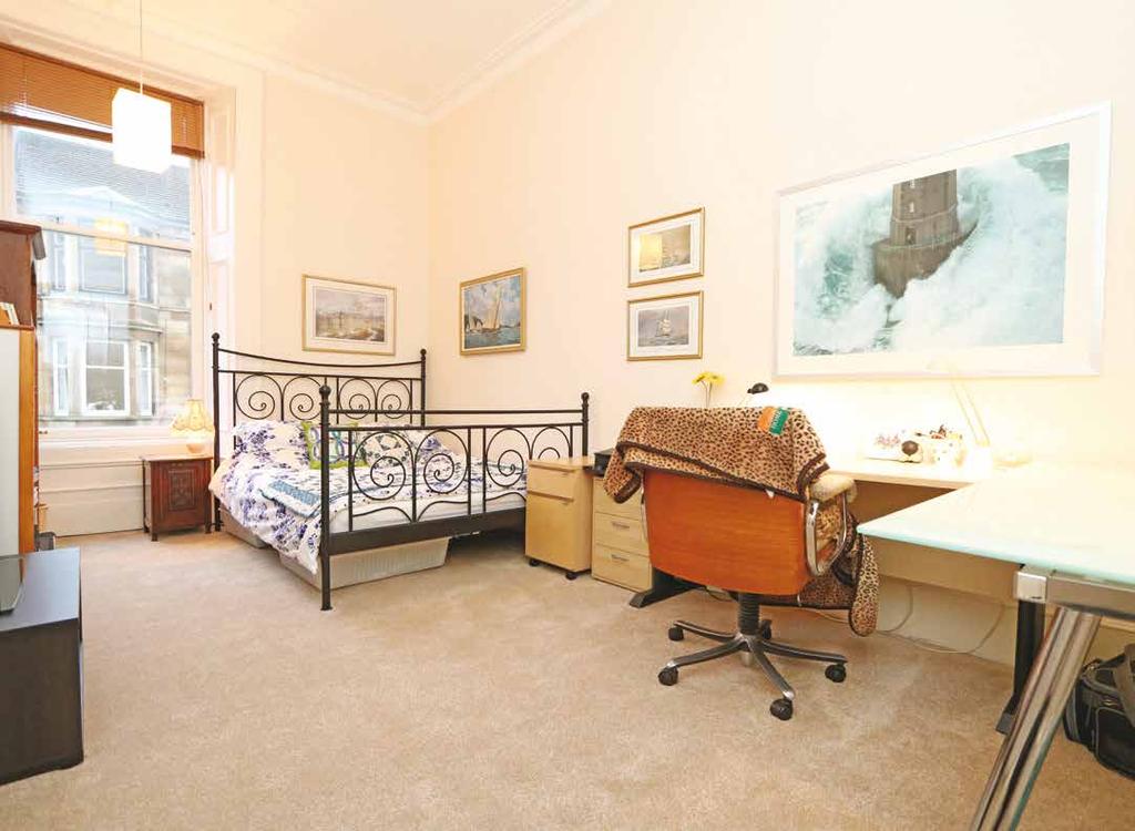 Accommodation Security entry system; communal entrance close; storm door entrance vestibule; impressive reception hall with traditional wooden flooring, three storage cupboards and ceiling cornice;