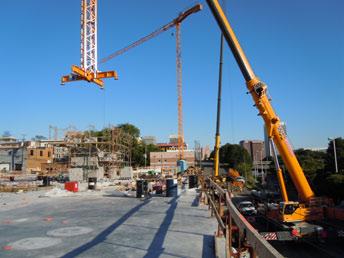 erecting two more tower cranes on Canal St. in downtown Richmond, VA.