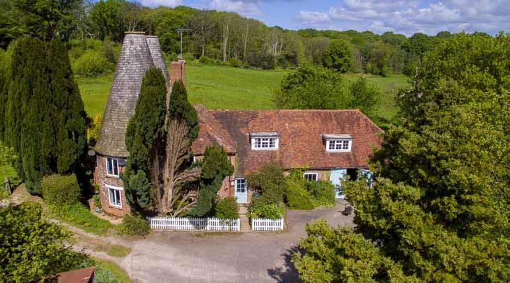 2 Oast Cottage Comprising: entrance hall with cloakroom; roundel sitting room with brick fireplace; kitchen; walk-in larder. Three bedrooms; bathroom (all modernised in 2013).