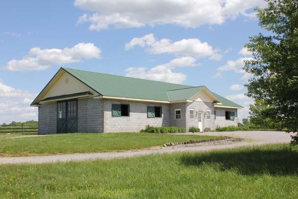HORSE FARM IMPROVEMENTS: Eight stall concrete block barn measuring 38 x 72 ; stalls are 12 x 14 with rear windows Loddon stalls; heated tack room; with toilet and hot and cold water;