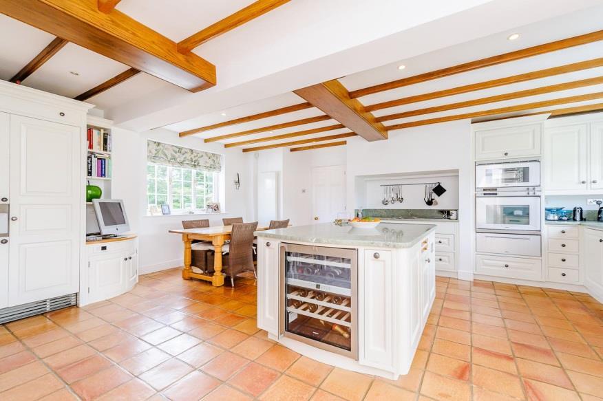 The accommodation in brief consists of a beautiful dual aspect kitchen/breakfast room with large central island, electric induction cooker and access into the adjoining utility room with matching