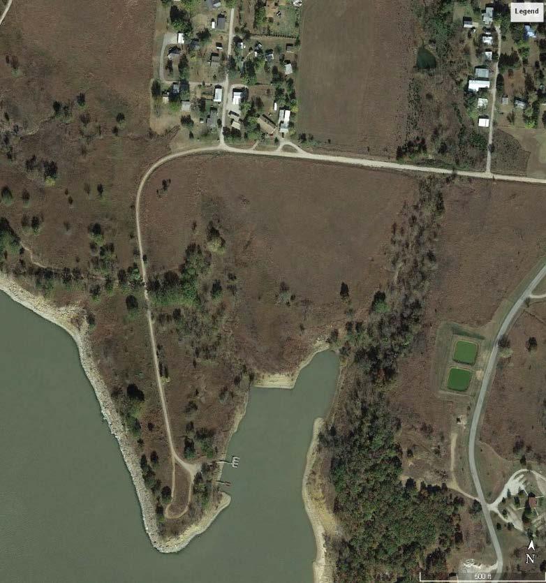 Figure 5-3: Fall River (northern shore) existing docks in Whitehall Bay Cove (Source: Google Earth, 2014) 5.