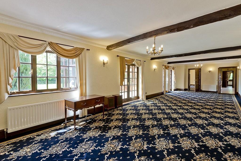 The entrance to the property is through a grand wooden door which opens into a wonderful, spacious hall with wooden flooring, wooden staircase, feature fireplace and galleried landing.