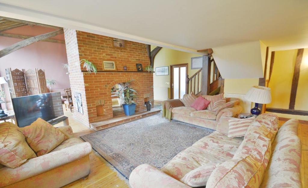 Built in just 2003 by a highly regarded local builder, this well appointed barn-style property comprises four/five double bedrooms with four en-suites, magnificent vaulted reception hall and kitchen/